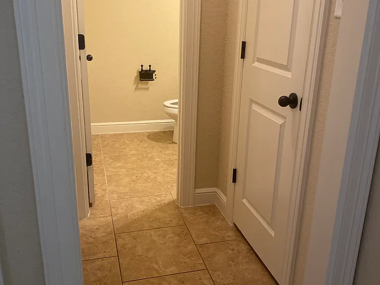 Entrance to coat closet and half bath