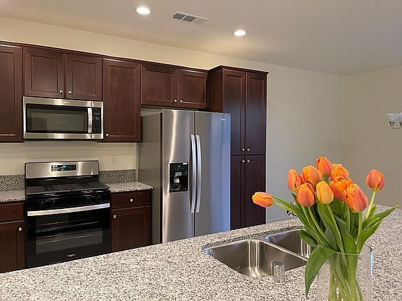 Very large kitchen island and includes all kitchen appliances.