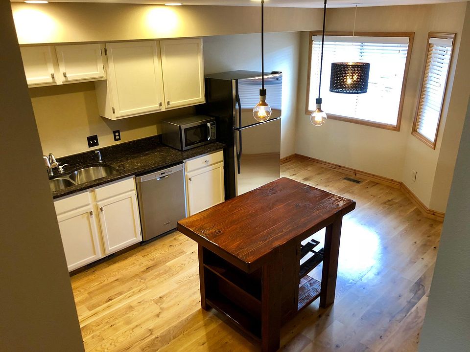 Stairs to bedrooms looking into kitchen