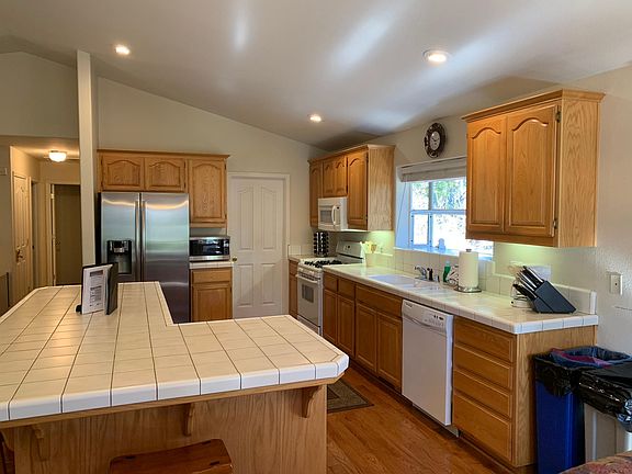 Fully stocked kitchen. Refrigerator, gas stove, microwave, dishwasher, dish ware, etc.
Washer and Dryer in pantry.