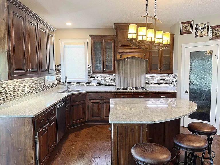 Gourmet Kitchen with Custom Cabinets and Stainless Steel Appliances