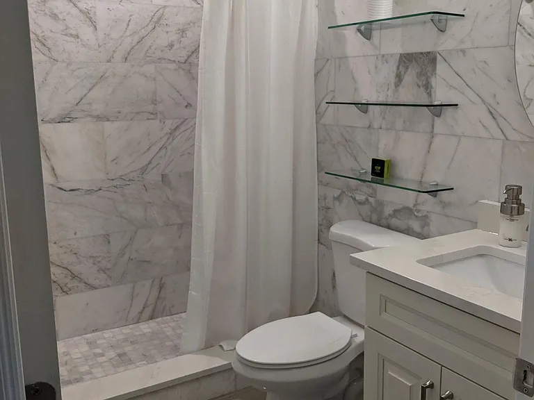 Guest Bathroom with White Marble Shower.