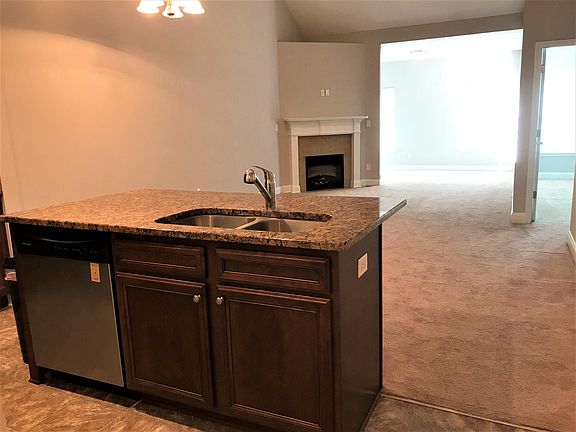 The large room off the living room can be used as a sunroom, office or play area.