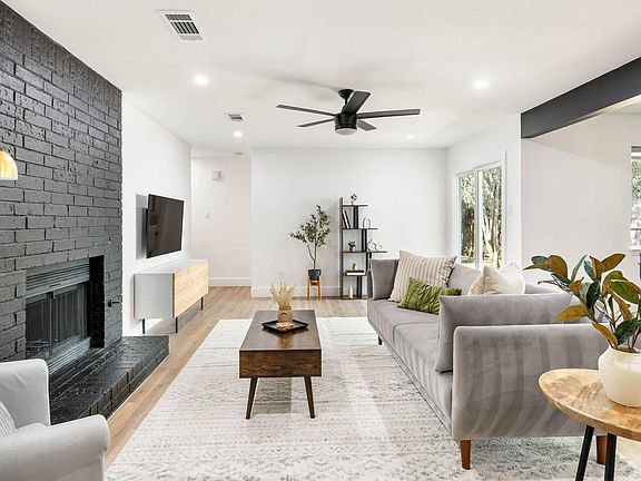 Relax in style with a fireplace, stylish decor, cozy couches & 55" HDTV with Amazon Prime Video, Apple TV, Disney+, HBO Max, Hulu, and Netflix!