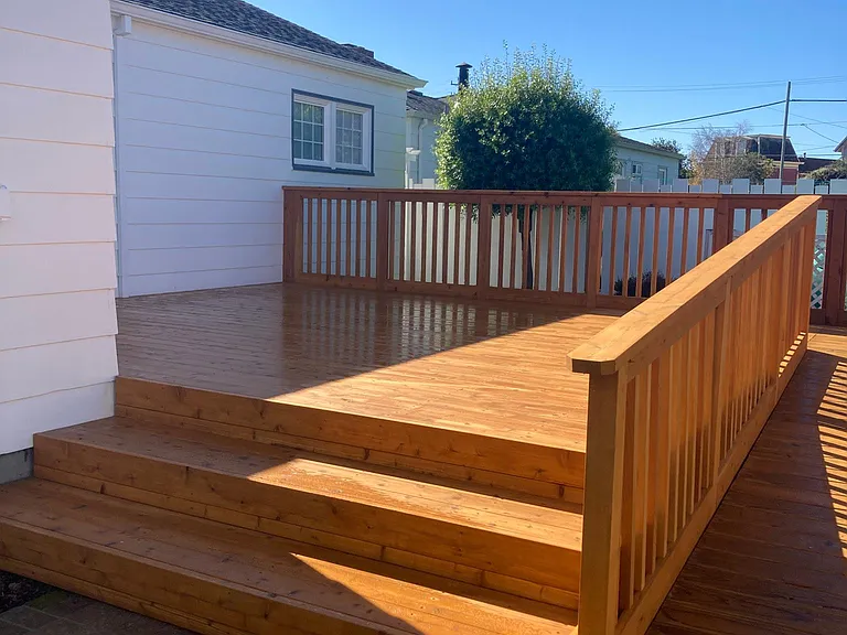 New deck with wheelchair ramp in back yard