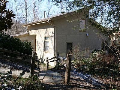 Stone steps going down to the front door.