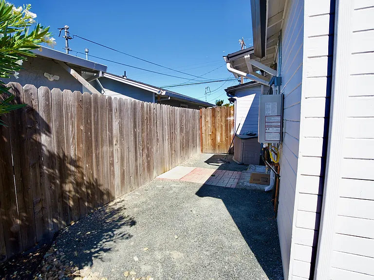 Side yard - laundry closet is located on the side and shared with front unit tenants
