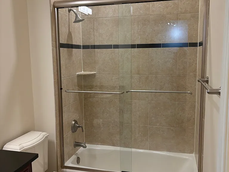 Bath w/ Glass Enclosed Shower.
