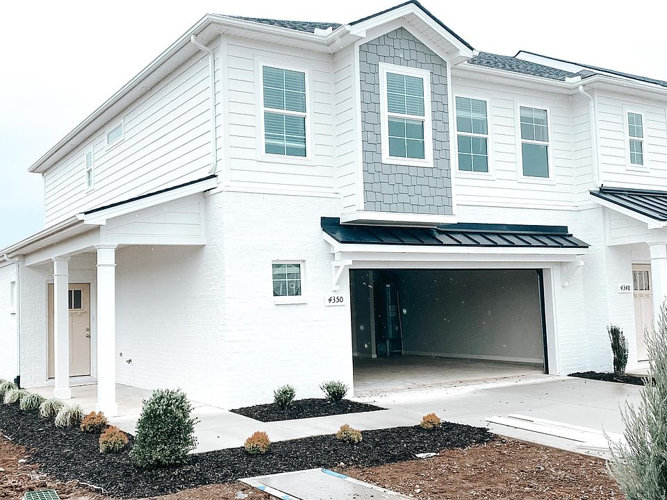 Left end unit with large finished 2 car garage (front door will be black matching the garage awning and the garage floor is finished - see last picture)