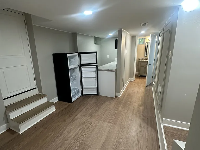 Basement Apartment Open Space (Backdoor leading to outside ground level on the left, stairs leading upstairs to Main Home on the right)