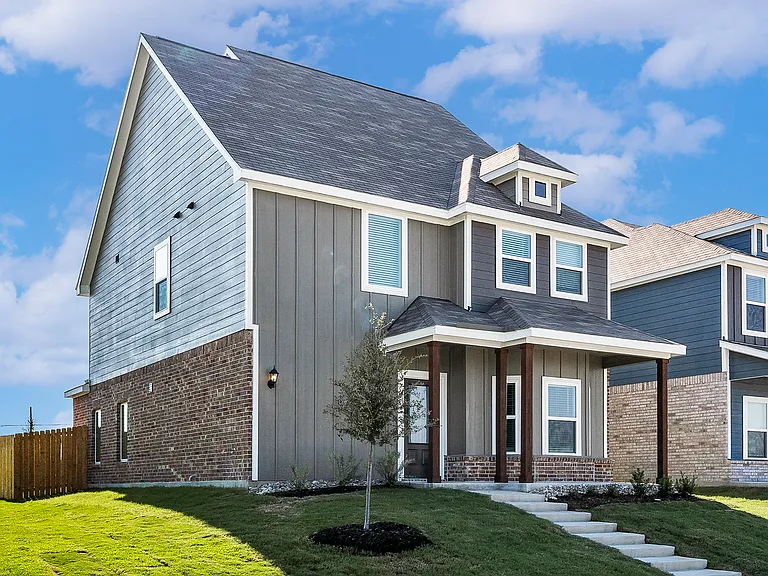 The Bluebonnet has a wonderful siding exterior with brick details.