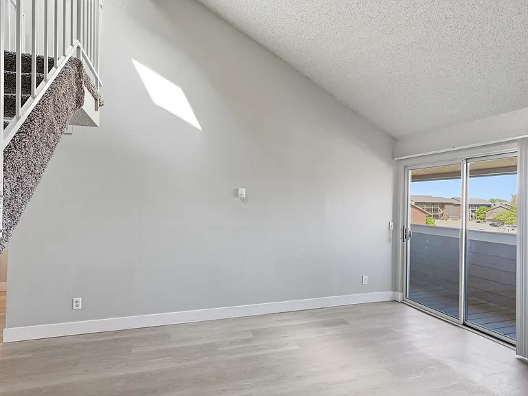 Comfort, warmth, and style come together in the living room equipped with a fireplace.