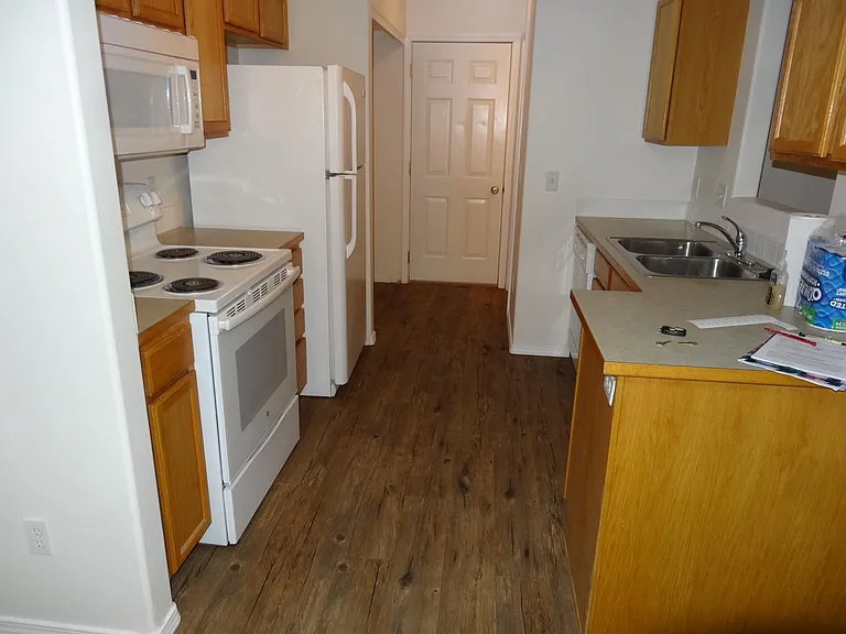 Kitchen with door to 2 car attached garage