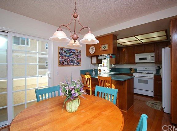 Family Room/Kitchen.  Sliding Glass Door leads out to a large balcony