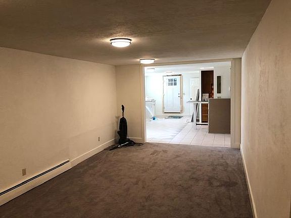 Living room view through to dining area.