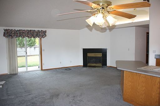 living + fireplace + patio