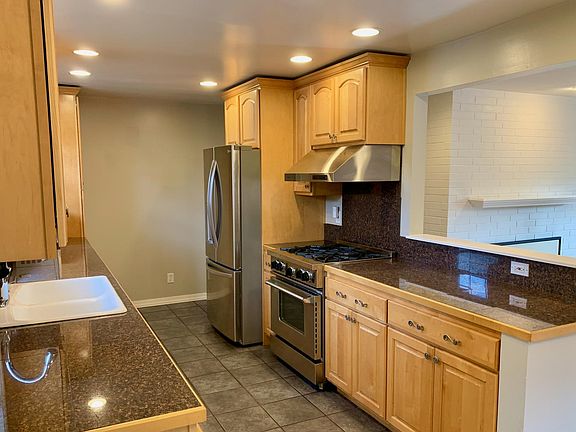 Chef's kitchen with gas range, zephyr hood, fridge with ice maker, dishwasher, microwave, double sink, disposal and lots of counter space / cabinets for storage.