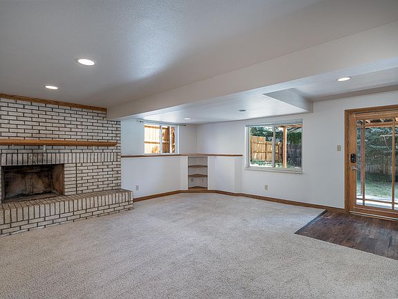 Living room with fireplace looking northeast.