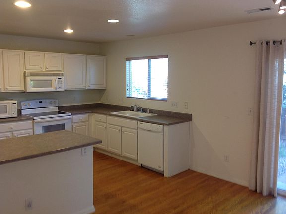 Kitchen with hardwood floors and large pantry