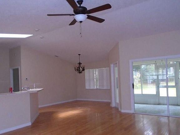 Open floor plan with large living room. Hard wood floors.