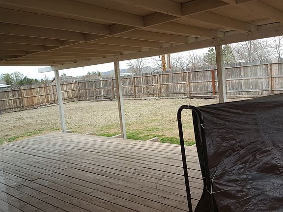 back patio and fenced in yard