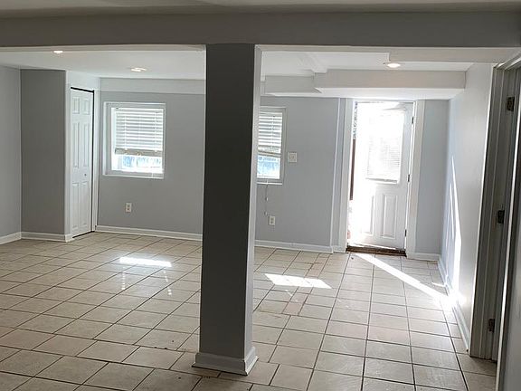 View of living room with door leading to side entrance
