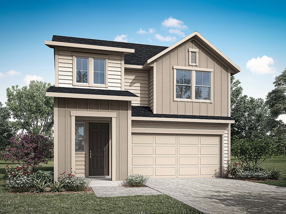 A two-story residential house with a garage, surrounded by trees and a grassy lawn in the foreground