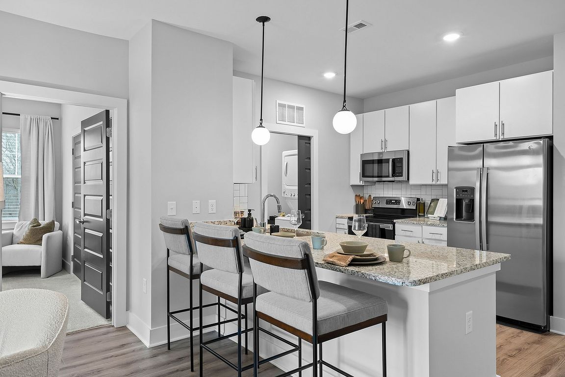 Kitchen with granite counters and stainless appliances