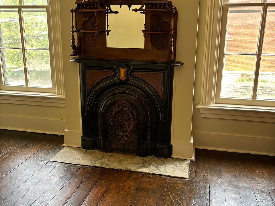 Bedroom with original fireplace.