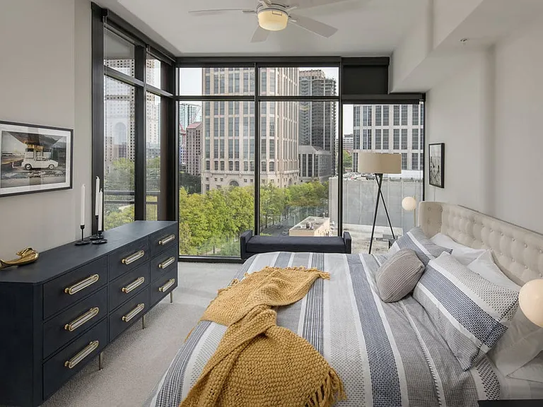 Floor to ceiling windows and ceiling fans in every room