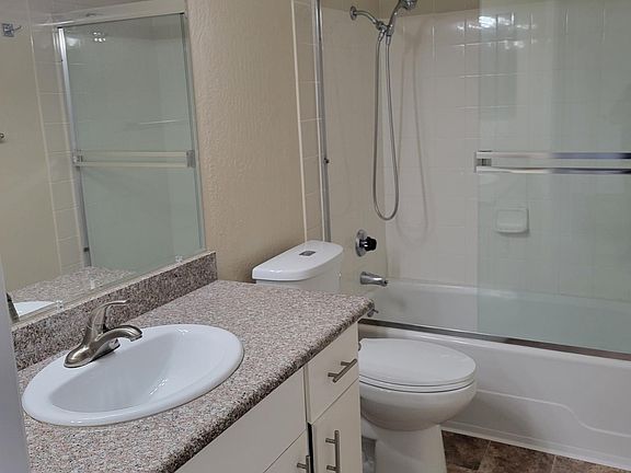 bathroom with granite counter
