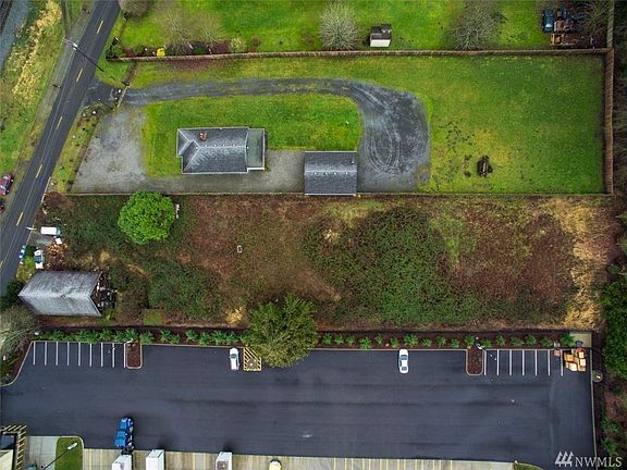 Acreage next door also for sale. 