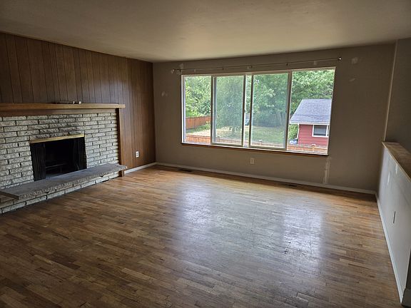 Living room with natural wood fireplace