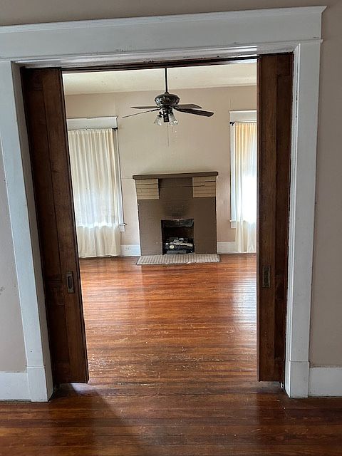 Looking into living room from formal dining room with pocket doors.