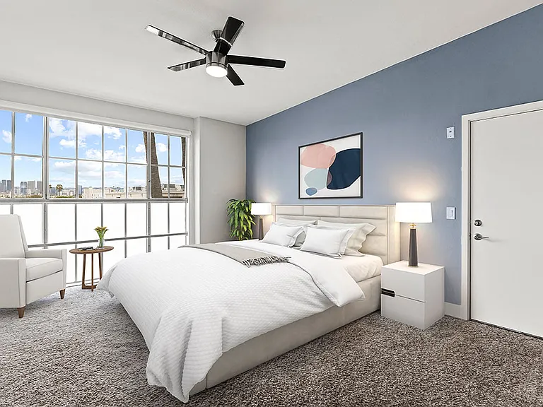 Bedroom with gorgeous window view and ceiling fan.