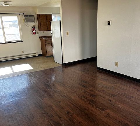 Livingroom looking into eating area, entry to kitchen