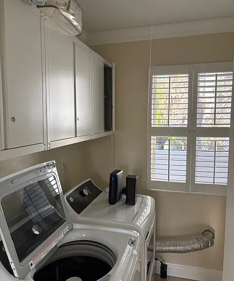 Laundry room with new Washer, Dryer and storage cabinets!