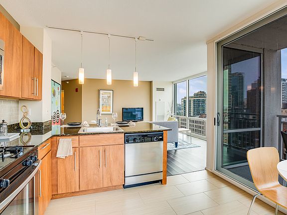 Explore our modern apartment homes with stunning city views through large windows