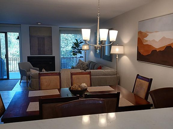 View from kitchen counter. Gas fireplace on back wall.