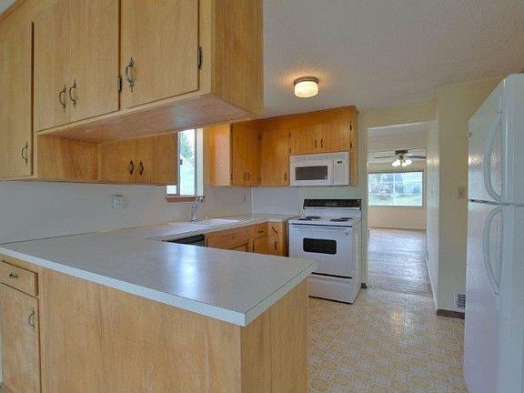 Kitchen with desk space too. All appliances stay!