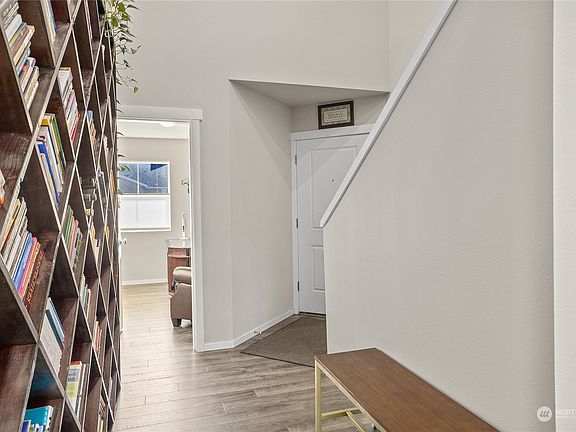 Entry into house with immediate options of stairs to the 2nd floor, entrance into the den all the 1st floor living and entertaining areas.>