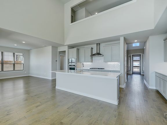 Kitchen in the Mercury home plan by Trophy Signature Homes - REPRESENTATIVE PHOTO