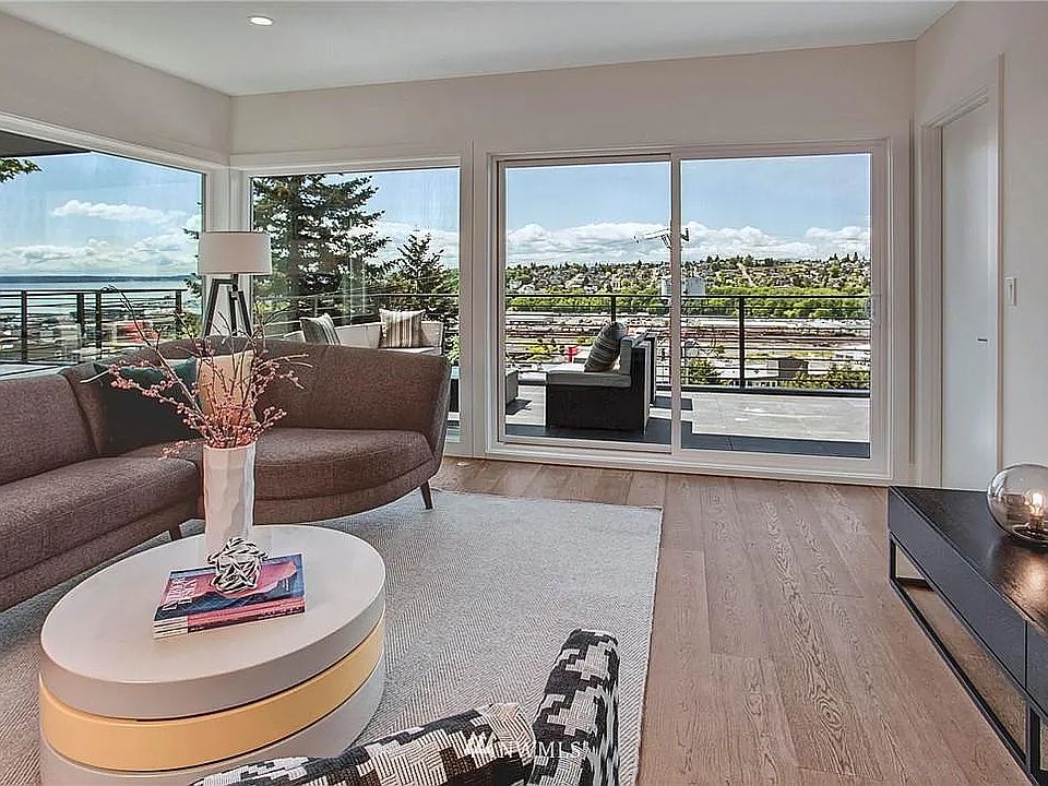 Wall of windows, large top deck, and beautiful panoramic views.