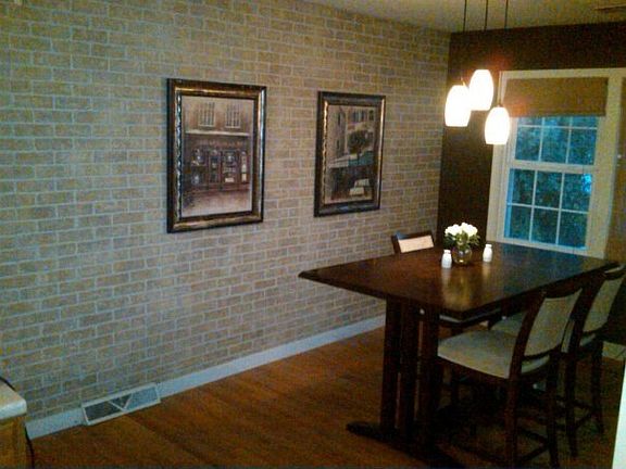 Dinning room with faux brick