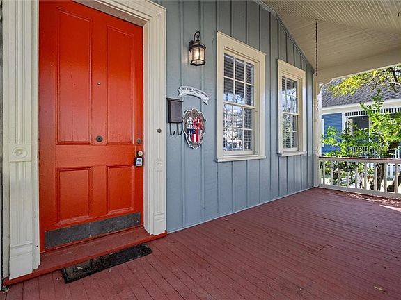 Doorway to property featuring board and batten siding