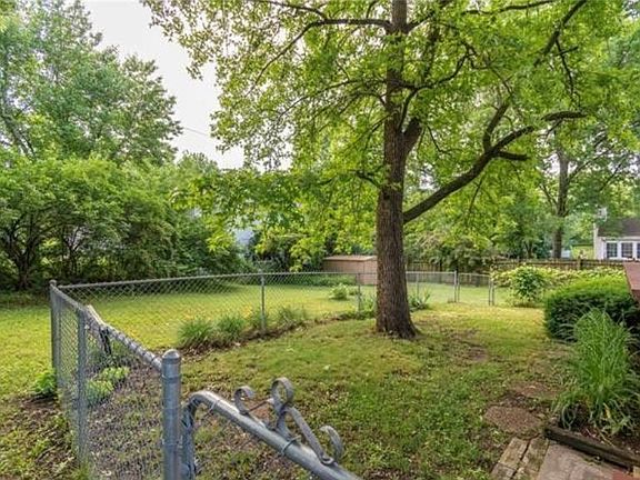 Partially fenced in backyard, perfect for a dog!