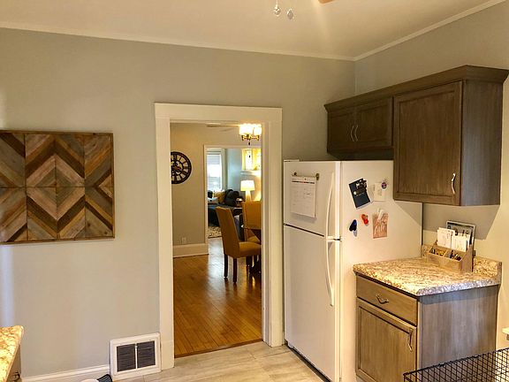 Separate big room kitchen leads to dining room leads to living room