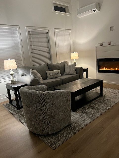 Quaint living room with electric fireplace