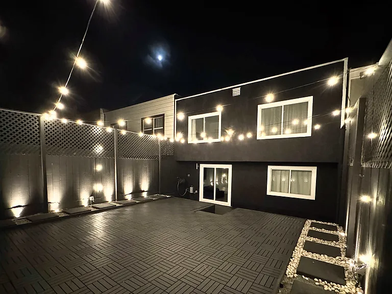 Lit backyard ready to host a party.