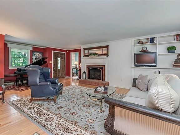 So much character in this home with the custom built-in shelves and three gas fireplaces.